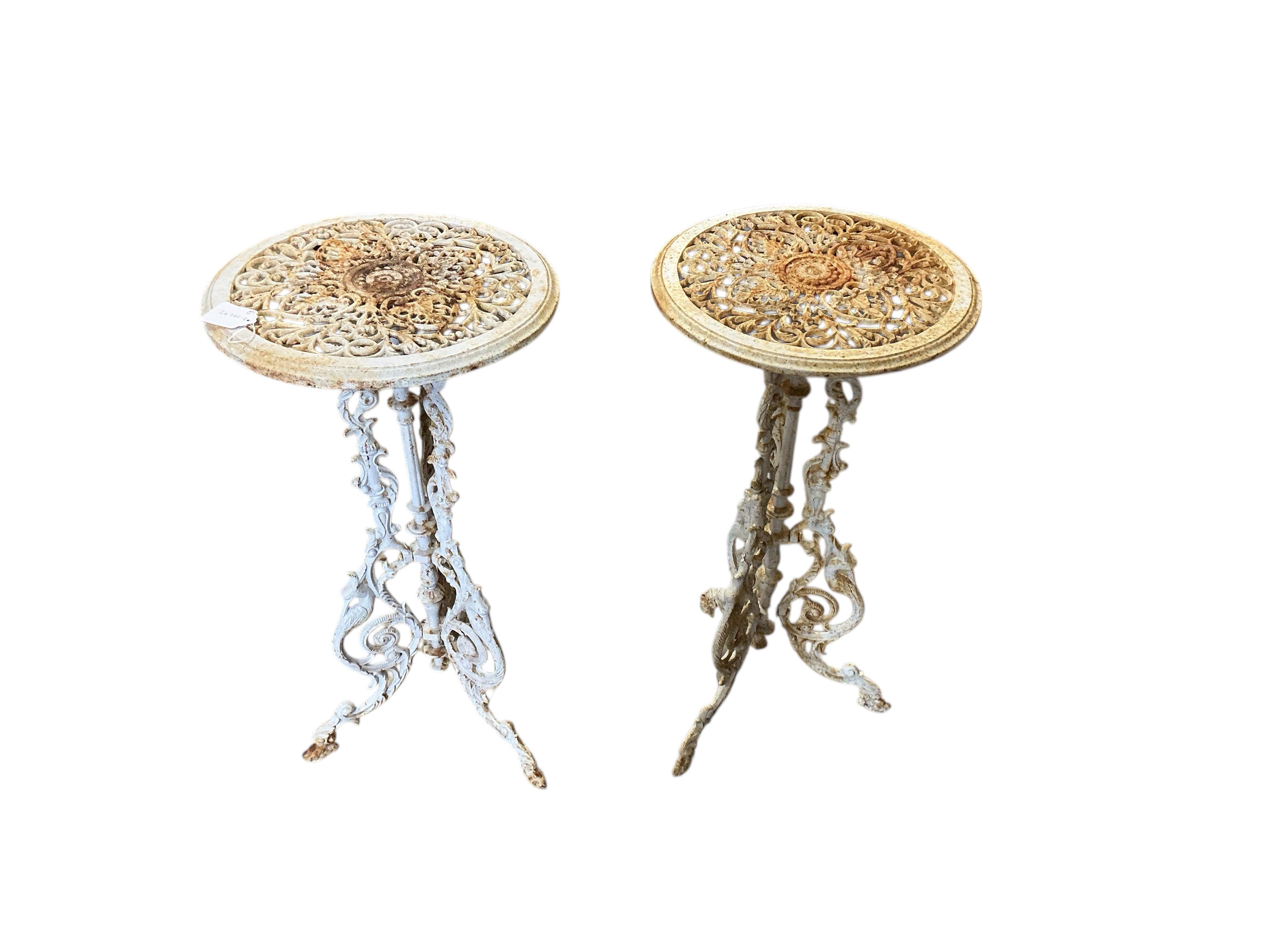 A pair of Victorian style circular painted cast iron stands, diameter 36cm, height 71cm